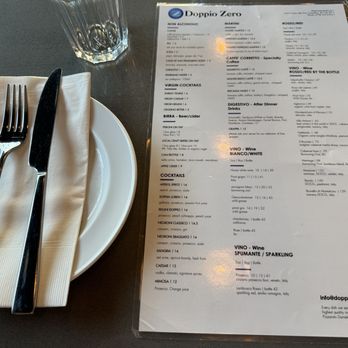 Doppio Zero Pizza - Table setting and back of menu~ (April 2024) - Italian Near Me - Coquitlam, British Columbia Doppio Zero Pizza - Table setting and back of menu~ (April 2024) - Italian Near Me - Coquitlam, British Columbia
