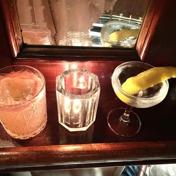 Temple Bar - Spicy flamingo (left) Martini straight up with a twist (right) - Lounges Near Me - New York, New York Temple Bar - Spicy flamingo (left) Martini straight up with a twist (right) - Lounges Near Me - New York, New York