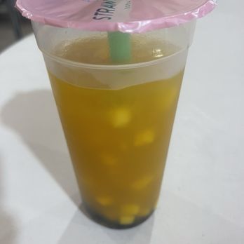 Straw & Spoon - Mango with a thin layer of boba. Yes, we drank some before the picture. Yes, it wasn't a big layer to begin with. - Bubble Tea Near Me - Redondo Beach, California