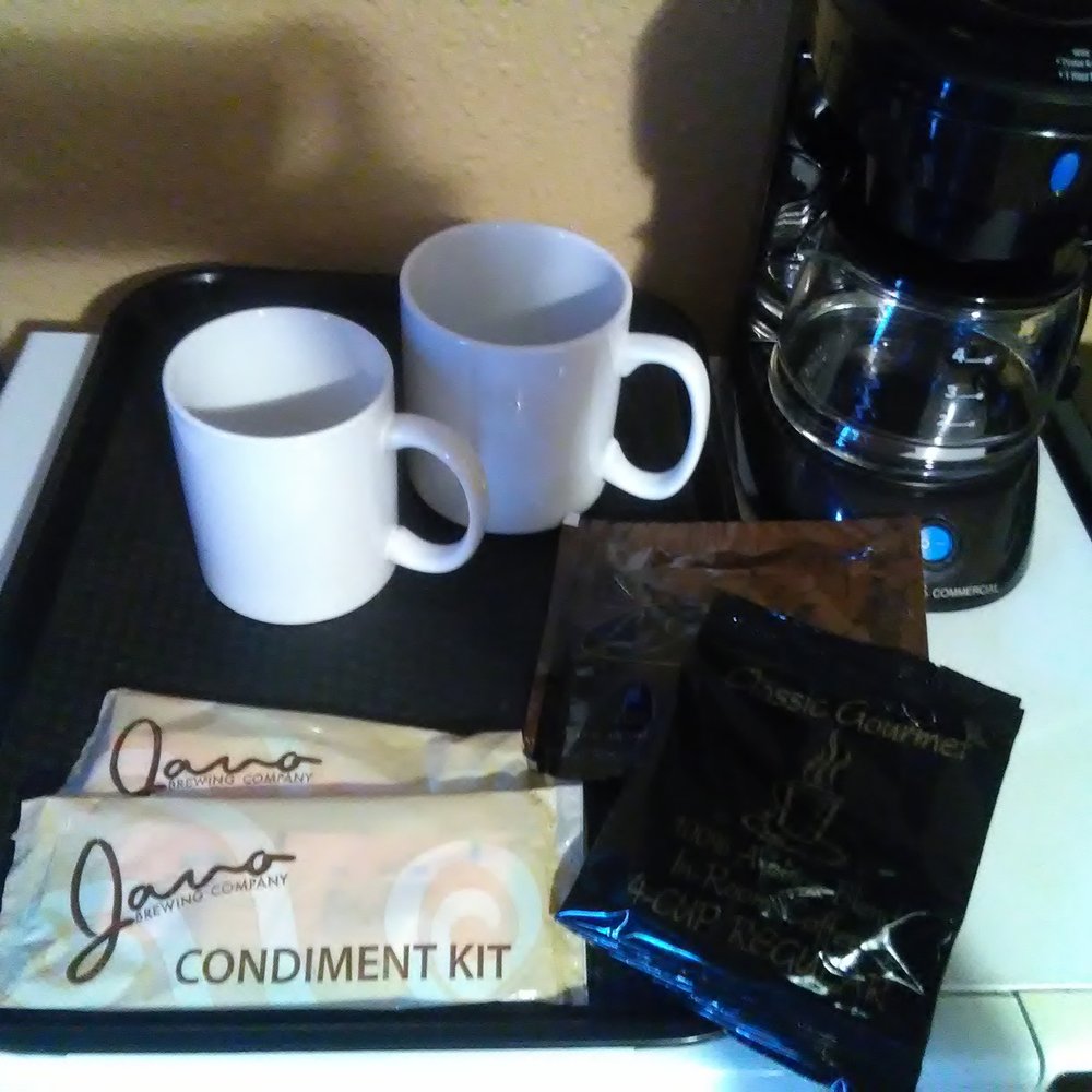 The Anchorage Downtown Hotel - Coffee maker with two mugs, two condiment sets, and three coffee packets (no decaf options, though). - Hotels Near Me - Anchorage, Alaska The Anchorage Downtown Hotel - Coffee maker with two mugs, two condiment sets, and three coffee packets (no decaf options, though). - Hotels Near Me - Anchorage, Alaska