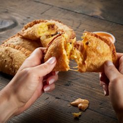Taco Bamba Gaithersburg - Taco Bamba's B.E.C. Empanada is a breakfast staple packed with scrambled eggs, bacon, and cheese, inside a fried empanada she...