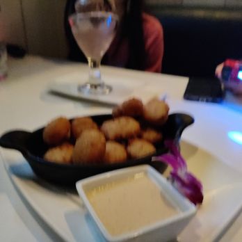 Nerdvana - Mac n cheese bites. The accompanying sauce is kind of like bang bang sauce - New American Near Me - Frisco, Texas
