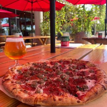 Frolic Brewing - Pepperoni and sausage pizza with a nice cold beer - Breweries Near Me - Westminster, Colorado