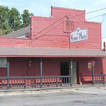 Know Place - a red building with a street sign - Bars Near Me - Victor, California