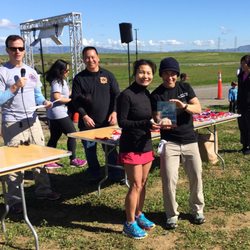 Receiving the trophy for 1st place women's finisher in the 5k