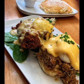 Ruby Slipper Marigny - Chicken St . Charles & Eggs Cochon Benedict Side of pancakes with bananas foster sauce - Breakfast & Brunch Near Me - New Orleans, Louisiana Ruby Slipper Marigny - Chicken St . Charles & Eggs Cochon Benedict Side of pancakes with bananas foster sauce - Breakfast & Brunch Near Me - New Orleans, Louisiana