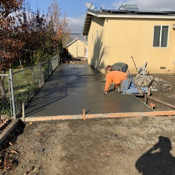 TH General Engineering - a concrete patio being poured - General Contractors Near Me