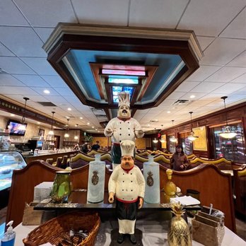 Page Plaza Restaurant - a chef statue in the center of the restaurant - American Near Me - Staten Island, New York