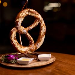 P.J.'s 1910 Pub - OVERsized Bavarian Pretzel Served with Honey Mustard & Gouda Cheese Sauce
