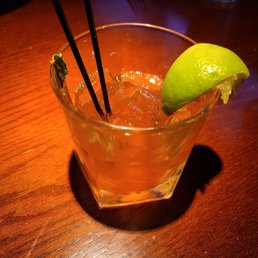 a close up of a cocktail with chopsticks