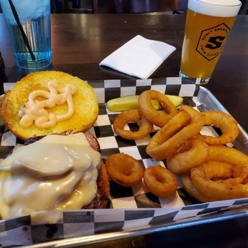 Boulevard Bar & Grille - Lexington - Reuben burger with onion rings and a Surly Axe Man lager - American Near Me - Circle Pines, Minnesota