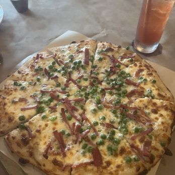 Coco - Pea & Prosciutto pizza and Pineapple Express drink - French Near Me - Buffalo, New York Coco - Pea & Prosciutto pizza and Pineapple Express drink - French Near Me - Buffalo, New York