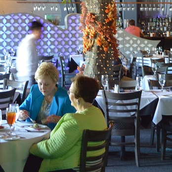 Genesis Steakhouse & Wine Bar - Genesis Steakhouse & Wine Bar inside people eating - Steakhouses Near Me - Houston, Texas