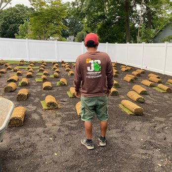 JC Landscaping & Pavers - a man standing in front of a garden - Lawn Services Near Me JC Landscaping & Pavers - a man standing in front of a garden - Lawn Services Near Me