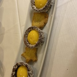 Tavernetta Maria Callas - This was brought when we ordered coffee. It was a crunchy shell (like a Ferrero Rocher) filled with a passion fruit cream