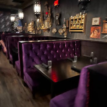 Voodoo Bayou - Rich, colorful velvet on dark wood gives a gothic feel. - Cocktail Bars Near Me - Orlando, Florida