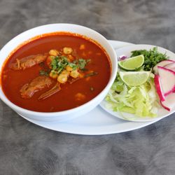 El Dorado Sinaloense Restaurant - Pozole de puerco servido con lechuga, rabanos, cebolla y limon.    Tortillas hechas a mano o tostadas.