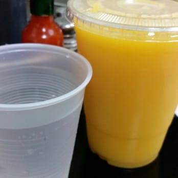 Scramblers Cafe - Large orange juice, next to a water cup. Probably not worth it to get the small size. - Breakfast & Brunch Near Me - Norco, California Scramblers Cafe - Large orange juice, next to a water cup. Probably not worth it to get the small size. - Breakfast & Brunch Near Me - Norco, California