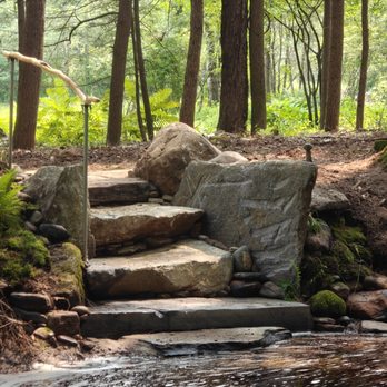Water Earth & Flowers - Stone staircase leading into a river. - Snow Removal Near Me - Leverett, Massachusetts Water Earth & Flowers - Stone staircase leading into a river. - Snow Removal Near Me - Leverett, Massachusetts