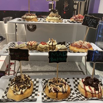 Cinnaholic - Display case of various custom specialty cinnamon rolls. - Desserts Near Me - Seattle, Washington