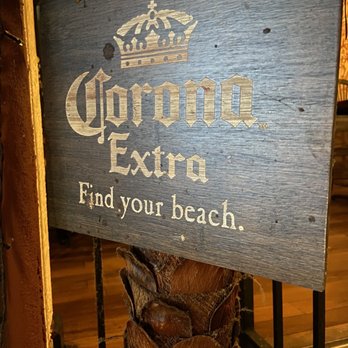 Fiesta Azteca Mexican Restaurant - a sign on a palm tree - Mexican Near Me - Melbourne, Florida