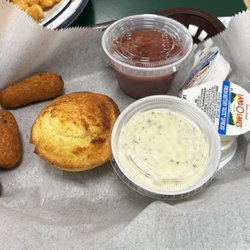 Central Cafe - Corn bread, hush puppies, cocktail sauce and tartar sauce.
