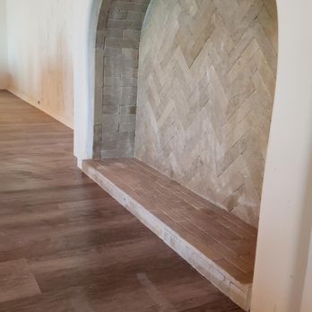 Precision Floor Covering - a fireplace in the middle of a room - Flooring Near Me - Irvine, California Precision Floor Covering - a fireplace in the middle of a room - Flooring Near Me - Irvine, California