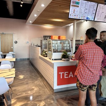 Tea Top - two people standing at a counter - Coffee & Tea Near Me - Carrollton, Texas Tea Top - two people standing at a counter - Coffee & Tea Near Me - Carrollton, Texas