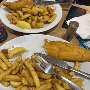 Laughing Halibut - Both of our orders ( taken about halfway through our meal) - Fish & Chips Near Me - London, XGL Laughing Halibut - Both of our orders ( taken about halfway through our meal) - Fish & Chips Near Me - London, XGL