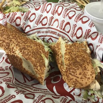 Quiznos - a sandwich and a drink on a table - Delis Near Me - Lorain, Ohio