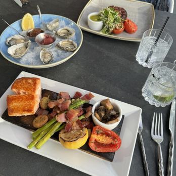 Six Seven Restaurant - Oysters on the Half-Shell Salmon - New American Near Me - Seattle, Washington Six Seven Restaurant - Oysters on the Half-Shell Salmon - New American Near Me - Seattle, Washington