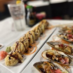 Nami Japanese Steakhouse & Sushi Bar - Baked mussels and tempura salmon roll.