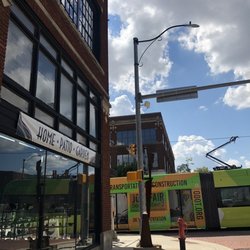 Good Earth Rocks Gallery - Good Earth Rocks Gallery: Outside off NW 8th Street; & Streetcar traveling on N Broadway