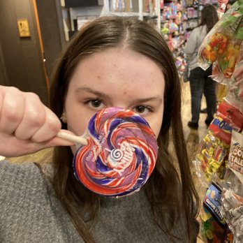 Cracker Barrel Old Country Store - My 14-year old hiding behind a lollipop she found in the front store. - American Near Me - San Antonio, Texas Cracker Barrel Old Country Store - My 14-year old hiding behind a lollipop she found in the front store. - American Near Me - San Antonio, Texas