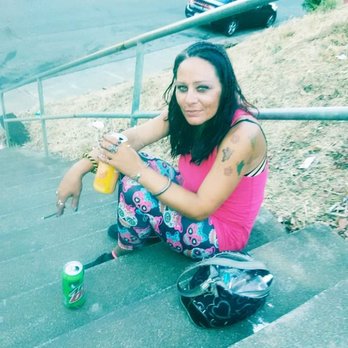 7-Eleven - a woman sitting on the steps with her skateboard - Convenience Stores Near Me - Vallejo, California