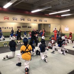 National Karate Schools - Instructor working on blitzing basics for intermediate sparring class.