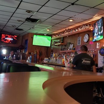 The Bubbler - a man sitting at a bar - Dive Bars Near Me - Milwaukee, Wisconsin