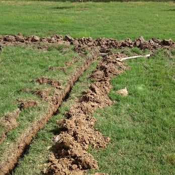 Integrity Landscape and Design - a trench dug in the grass - Landscaping Near Me - Arlington, Tennessee Integrity Landscape and Design - a trench dug in the grass - Landscaping Near Me - Arlington, Tennessee