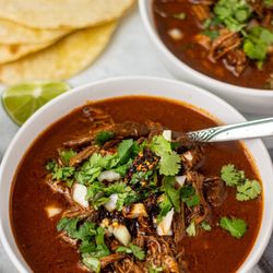 El Toro Taqueria & Seafood - Nuestros caldos son sobre salientes en su perfección, como este caldo de Birria con tortillas hechas a mano.