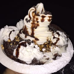 Suzette's Bakery - Turtle Funnel Cake: choc chips, funnel cake, whipped cream, ice cream, powdered sugar, nuts & caramel sauce drizzle.