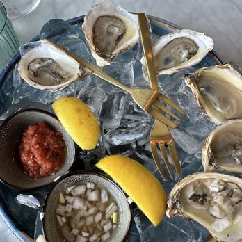Wren - oysters (white wine mignonette / cocktail sauce) - Cocktail Bars Near Me - Tysons, Virginia Wren - oysters (white wine mignonette / cocktail sauce) - Cocktail Bars Near Me - Tysons, Virginia