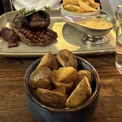 Momo - Steak with shiitake mushroom and peppercorn sauce with chips. Side of potato also in photo.