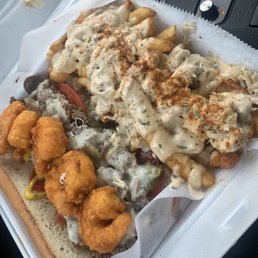 Cheesteak with fried shrimp and Old Bay crab fries Cheesteak with fried shrimp and Old Bay crab fries