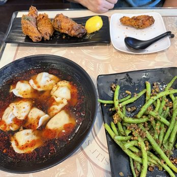 Dumpling World - Fried Chicken Wings, spicy sour Beef & Onion Spicy And Sour Dumplings, garlic green string beans - Chinese Near Me - Sugar Land, Texas