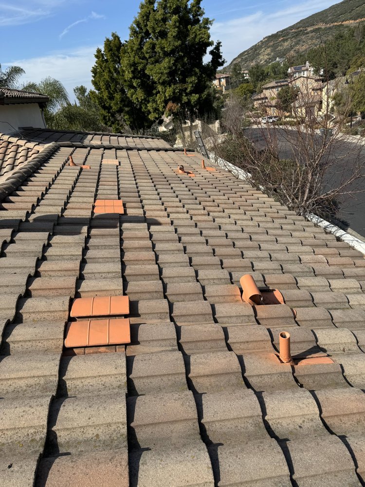 Slide of Spootless Roofing
