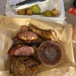 Brisket, jalapeño cheese sausage & chicken plus 1 Meat and 2 Sides Plate