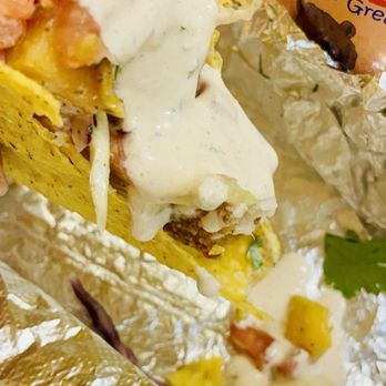 American Burrito - a hand holding a burrito - Mexican Near Me - Fort Montgomery, New York American Burrito - a hand holding a burrito - Mexican Near Me - Fort Montgomery, New York
