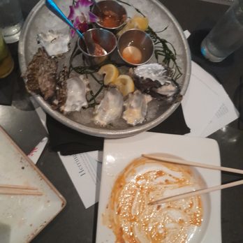 Herringbone Waikiki - Completed buffalo octopus, Hamachi crudo, and Wildcat oysters. - Seafood Near Me - Honolulu, Hawaii