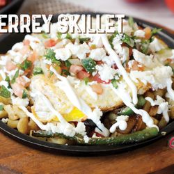 Monterrey Mexican Grill & Bar - Sizzling skillet loaded with homemade potatoes topped with chorizo, grilled bell peppers, grilled onions, 2 eggs cooked to your liking....