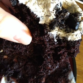 Baked & Wired - The inner workings of the vegan Oreo cupcake, half eaten - Bakeries Near Me - Washington, DC, District of Columbia